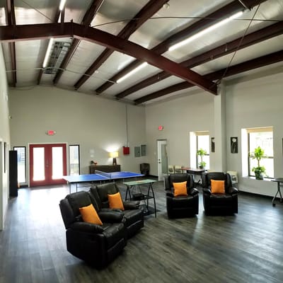 Interior lounge area with seating and table tennis