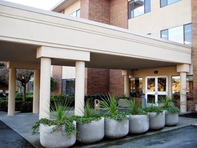 Front entrance of a care facility with planters