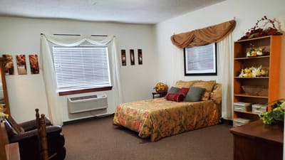 Cozy bedroom with floral bedding and decor