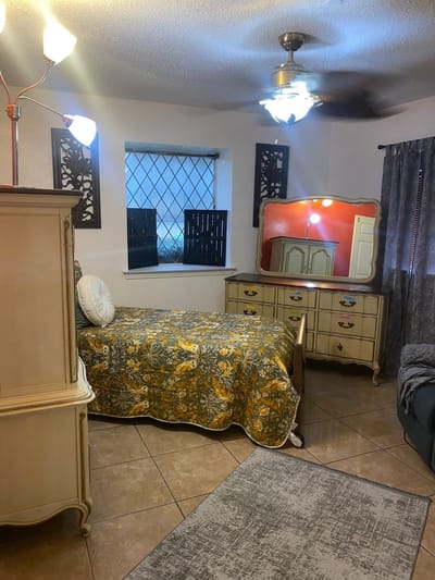 A cozy resident room with a bed and furniture