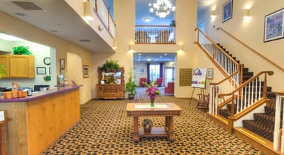 Interior view of a welcoming common area with a reception desk