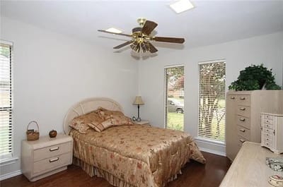 Cozy private room with a bed and large windows