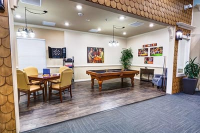 Activity room with pool table and seating area