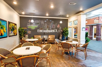 Bright common area with seating and artwork