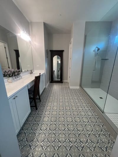 Bright, modern bathroom with a large shower and vanity