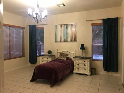 Private bedroom with a bed and decorative elements