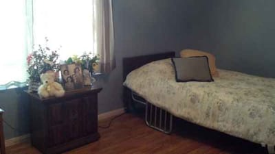 Cozy resident room with bed and decorations