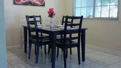 A dining table set up in a bright room