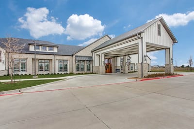 Building entrance with covered drive-through area