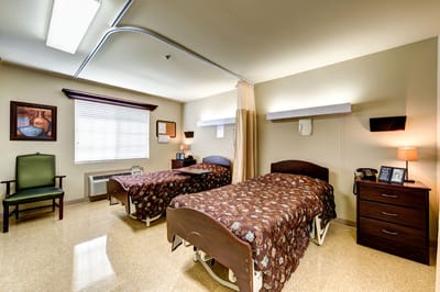 An interior view of a resident room with two beds