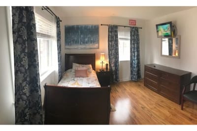 Cozy private resident room with television and decor