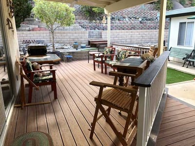 Outdoor seating area with wooden deck and benches