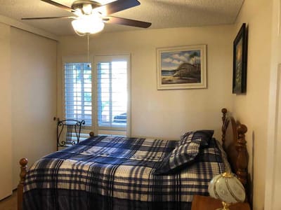 Cozy bedroom with window and ceiling fan