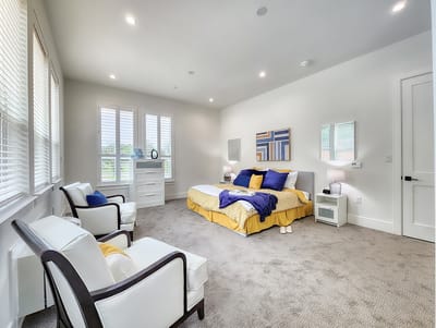A bright, well-furnished resident room with modern decor