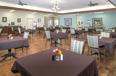 Well-set dining room with tables and flowers