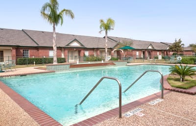 Swimming pool surrounded by facility buildings