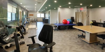 Interior therapy room with equipment and exercise balls.