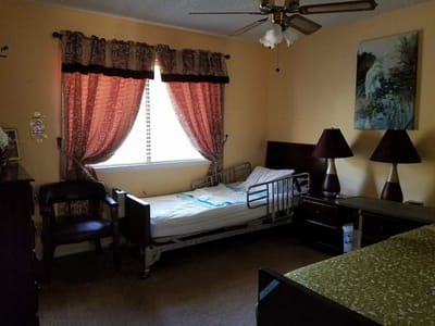A private bedroom with a hospital bed and decor