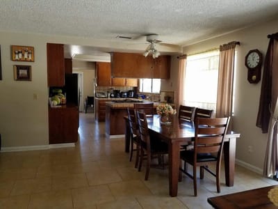 Dining area with wooden table and chairs
