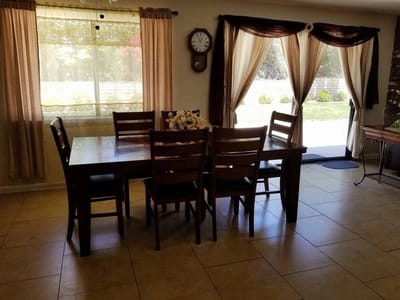 Bright dining area with a wooden table and chairs