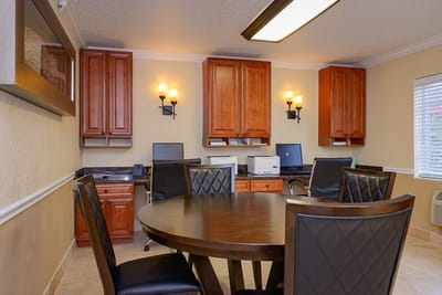 Interior office space with a round table and computers