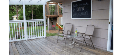 Outdoor seating area with chairs and a table.