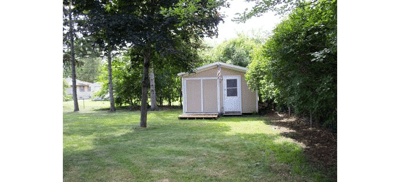 Outdoor view of a small building with trees