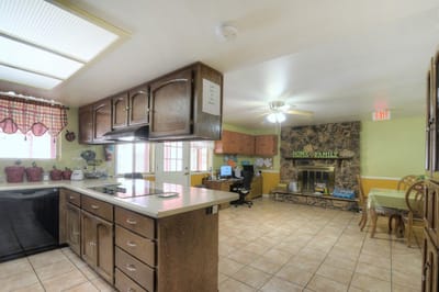 Bright common area with a kitchen and seating