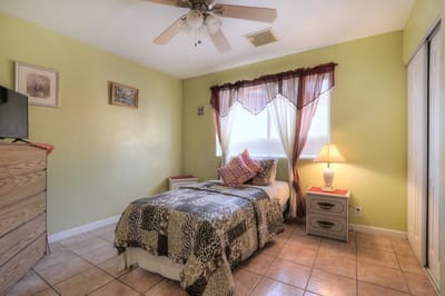 Cozy resident room with a bed and dresser