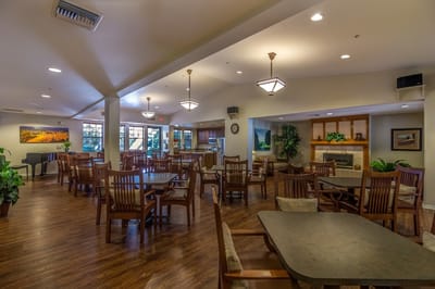 Interior view of a dining room area with tables and chairs