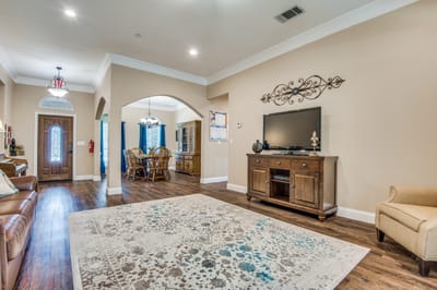 Bright common area with wooden furniture and decor