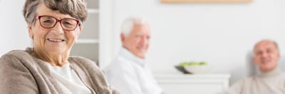 Three residents enjoying time together in a common area