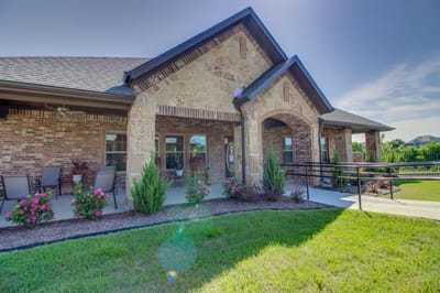 Exterior view of Mayberry Gardens building with landscaping