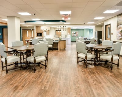 Welcoming common area with dining tables and decor