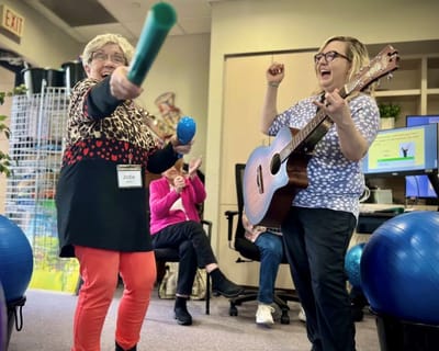 Residents participating in a fun activity with music