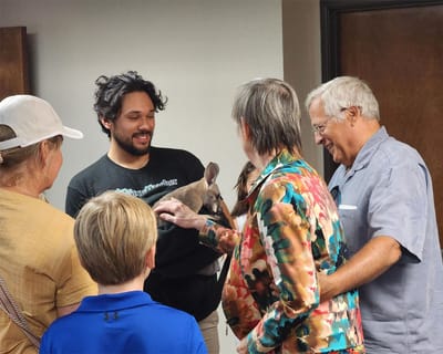 Residents interacting with an animal during a visit