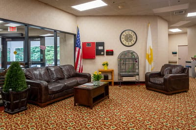 Cozy common area with seating and decorative plants