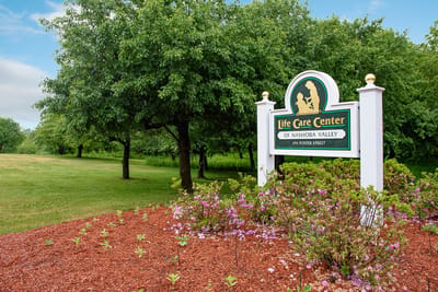 Signage for Life Care Center of Nashoba Valley with landscaping