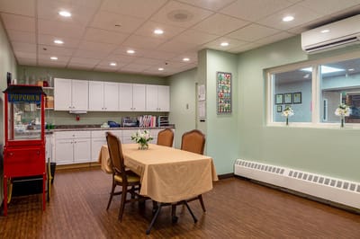 Interior common area with a table and popcorn machine