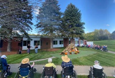 Residents enjoying an outdoor fall celebration event