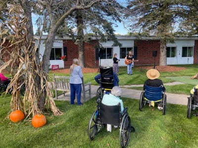 Residents enjoying live music in the garden area