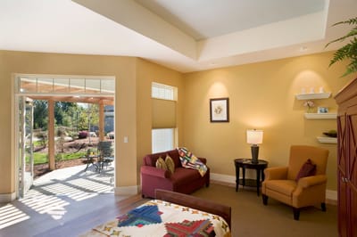 Bright interior of a resident room with garden view