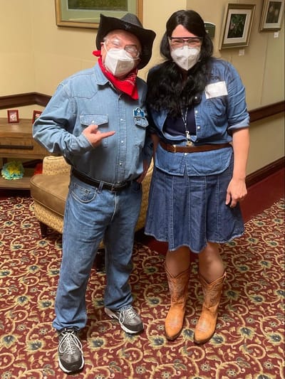 Staff dressed in themed attire with masks