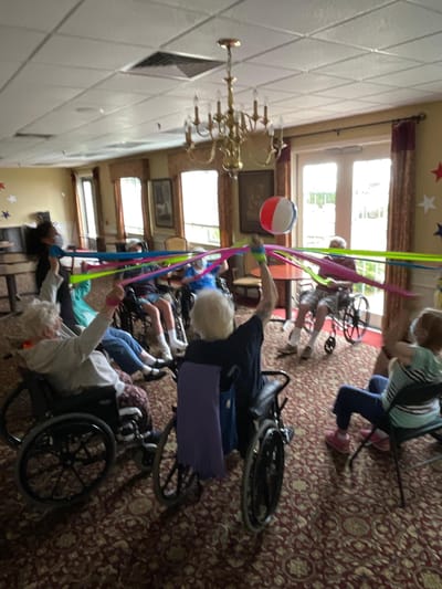 Residents participating in a colorful group activity