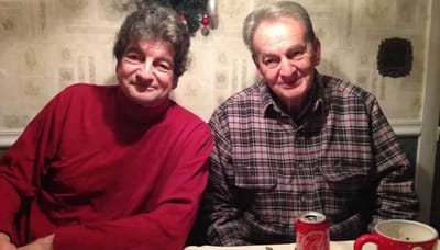 Two residents sitting together at a table