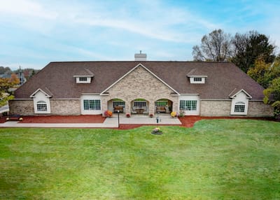 Exterior view of Legacy Care Home surrounded by lawn