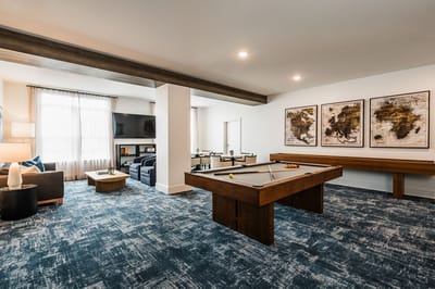 Common area with pool table and seating