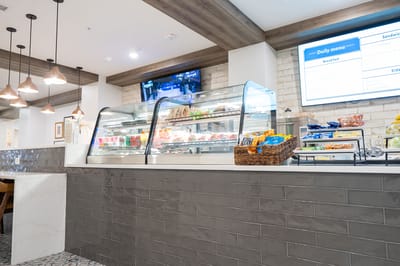 Interior view of a dining area with food display