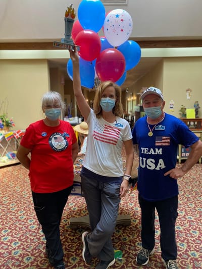 Residents and staff celebrating with patriotic decorations