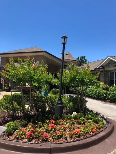 Entrance area with flowers and lamp post